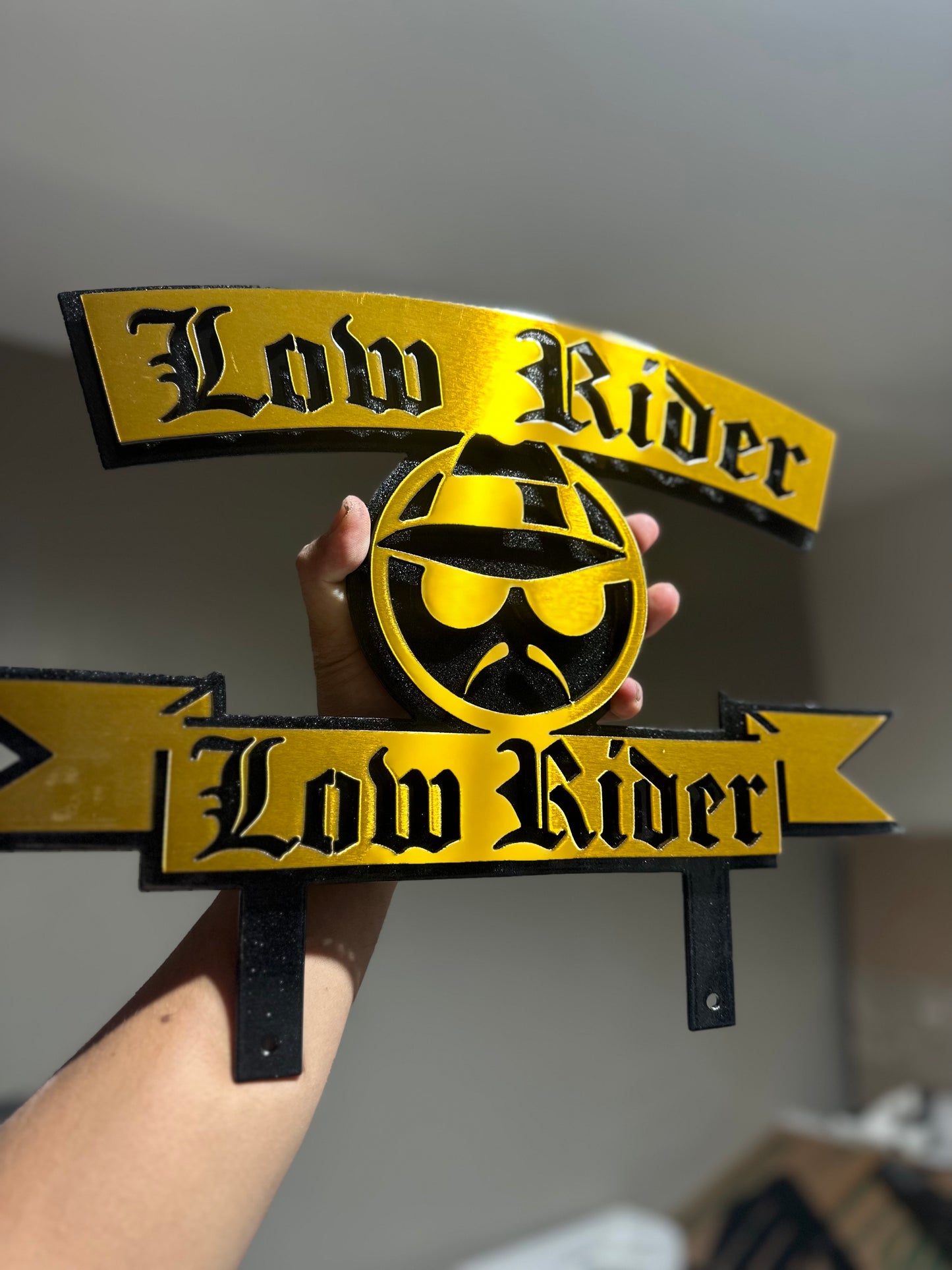 LOWIDER PLAQUE W/ LOWRIDER POWDER COATED BLACK AND GOLD 17x12 Inches